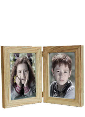 Double wooden hinged picture frame with photos of a girl and a boy