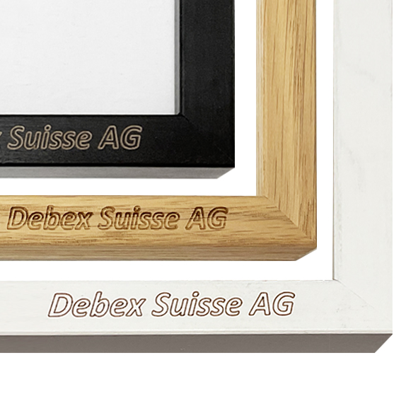 Close-up of three picture frame corners in black, oak, and white with Debex Suisse AG branding